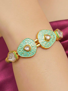 Close-up of a woman wearing an ornate traditional Mint Green Meenakari Bracelet with Meenakari, Kundan and Matt Finish. Festive outfit paired with a premium imitation Meenakari bracelet in India. Festive Diwali look enhanced with an imitation Meenakari bracelet.