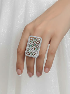 Close-up of a woman wearing an ornate Western Mint Green (Silver Polish) Diamond Ring with American Diamond and Colored Stones. Bride-to-be styled in a premium American diamond artificial Ring for her reception party. A woman wearing a luxury American diamond Ring styled beautifully for a wedding guest look in India.