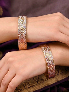 Close-up of an a women wearing ornate traditional (Gold Polish) Gold & Silver Bangles Set. It’s comfortable and lightweight enough for everyday wear, and it also looks absolutely beautiful and elegant. The design is stylish, the finish is impressive, and it feels really pleasant to wear all day.