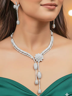 Close-up of a woman wearing an ornate Western American Diamond Silver Collar jewellery set and earrings with American Diamond. Reception-ready look completed with American Diamond artificial jewelry set. Close-up of American diamond Necklace styled for a reception party.