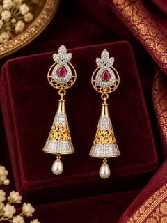 Niral Earrings – gold jhumka earrings with ruby pink stone and pearl drops in a gift box, everyday and haldi jhumkas