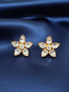The Magnolia tyaani kundan stud Earrings are gold, flower-shaped with clear teardrop American diamond petals and round diamonds at the center. Indo-western outfit styled with a lightweight Kundan Studs Earrings. It’s comfortable and lightweight enough for everyday wear, and it also looks absolutely beautiful and elegant. The design is stylish, the finish is impressive, and it feels really pleasant to wear all day.