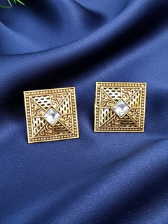 Close-up of a woman wearing an ornate traditional (Gold Polish) White Studs Earrings with Kundan and Filigree Work. Festive Diwali outfit paired with a premium Kundan Studs Earrings. Perfect for office and Everyday Wear.