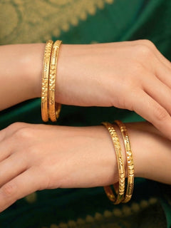 Close-up of an a women wearing ornate traditional (Gold Polish) Bangles Set. It’s comfortable and lightweight enough for everyday wear, and it also looks absolutely beautiful and elegant. The design is stylish, the finish is impressive, and it feels really pleasant to wear all day.