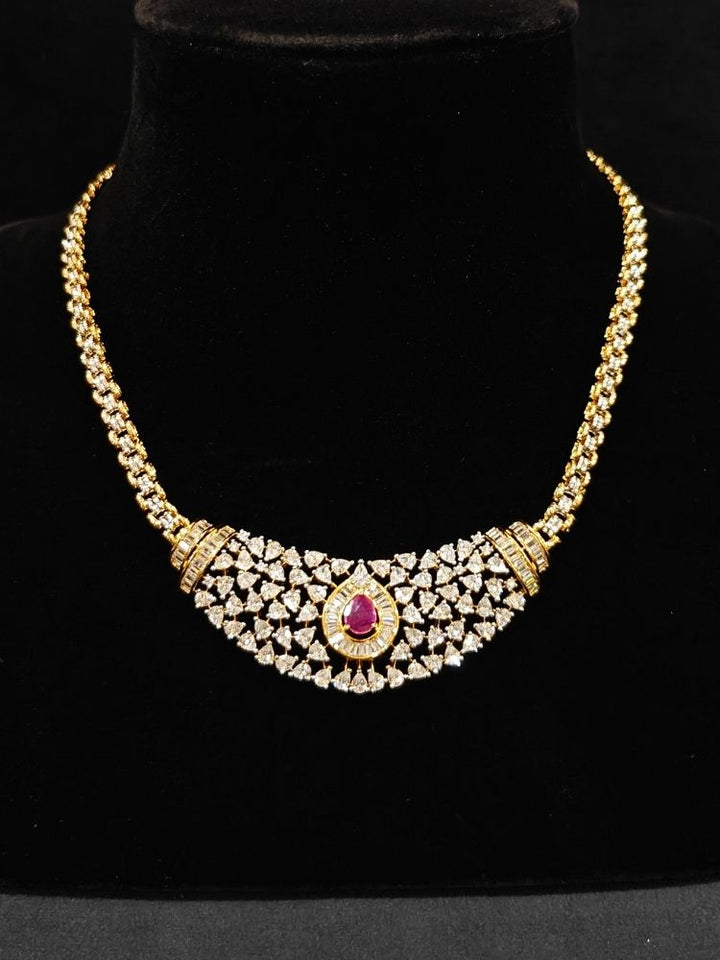 Close-up o an ornate Western (Silver Polish) Pink Collar jewellery set and earrings with Pink Colored Stone and American Diamond.Woman styling a statement American diamond necklace with an off-shoulder gown for a reception. Party wear outfit completed with a lightweight American diamond necklace.