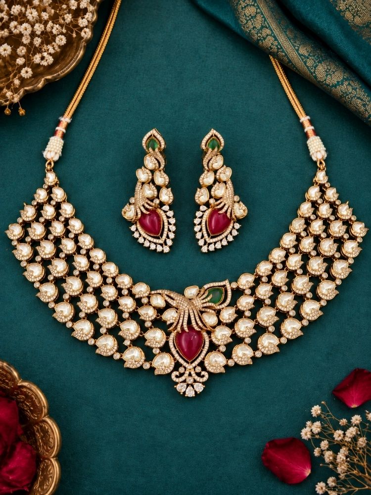 Primrose Necklace Set with earrings on fabric – a heavy gold kundan and pearl collar necklace with ruby red centre stone, traditional jewellery set for women