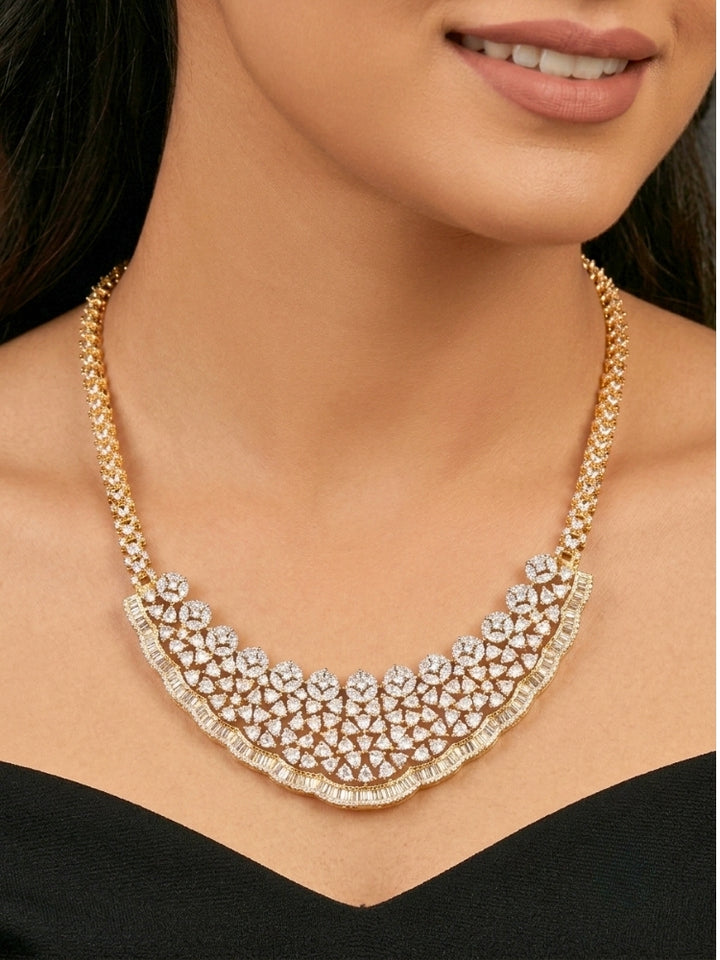 Close-up of a woman wearing an ornate Western (Silver Polish) Collar jewellery set and earrings with American Diamond. Party wear outfit completed with a lightweight American diamond necklace. Reception-ready look featuring a American diamond jewelry set.