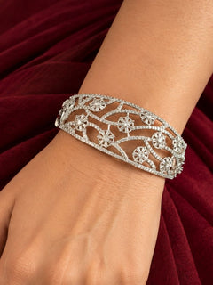 Colombine Silver Floral Zirconia Bracelet worn on the wrist – a broad openable silver bracelet with an American diamond floral vine pattern, openable cocktail bracelet for women