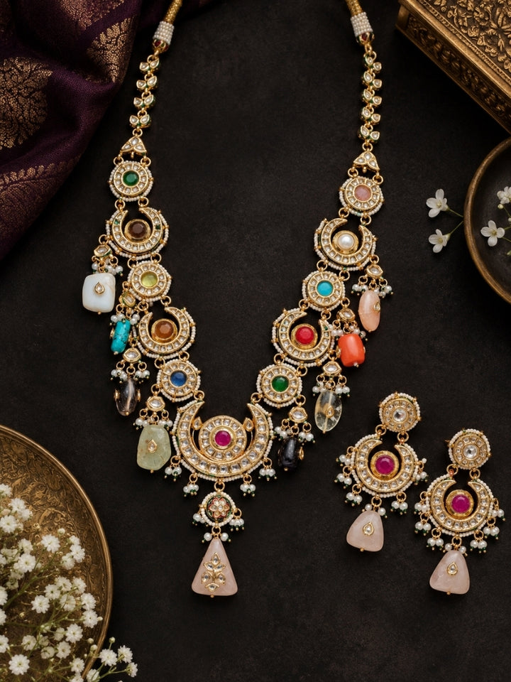 Flat lay of Multi-Color Navrang CS long necklace set with chandbali earrings on dark background