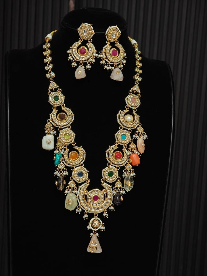 Multi-Color Navrang CS long necklace and earrings set displayed on black jewellery bust