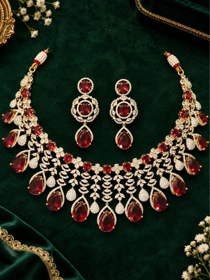 Chantilly Necklace Set on display – a silver-tone American diamond collar necklace with ruby red teardrop stones, with matching earrings, premium artificial jewellery online