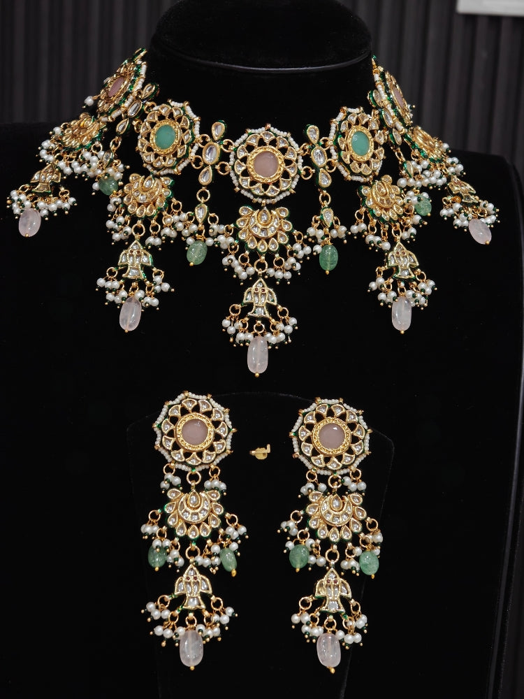 Pastel Kundan choker and chandelier earrings on a display bust with mint and blush drops