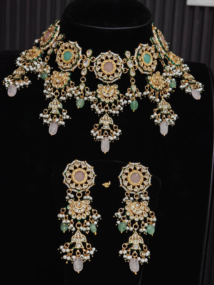 Pastel Kundan choker and chandelier earrings on a display bust with mint and blush drops