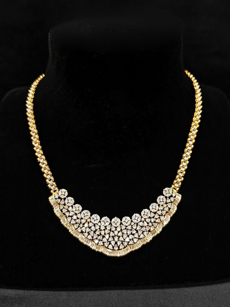 Close-up of  an ornate Western (Silver Polish) Collar jewellery set and earrings with American Diamond. Party wear outfit completed with a lightweight American diamond necklace. Reception-ready look featuring a American diamond jewelry set.