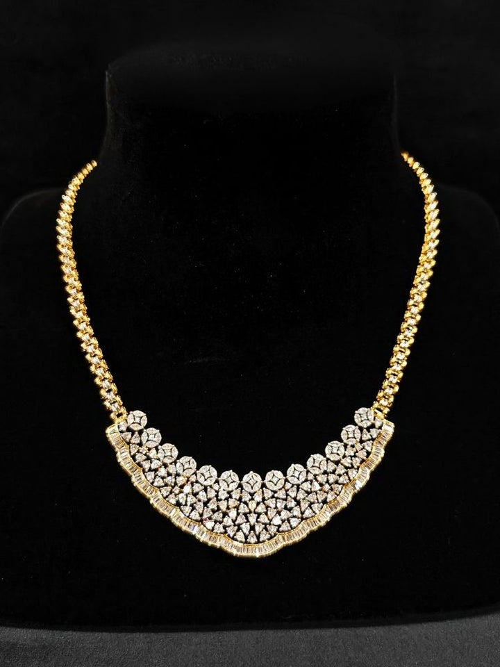 Close-up of  an ornate Western (Silver Polish) Collar jewellery set and earrings with American Diamond. Party wear outfit completed with a lightweight American diamond necklace. Reception-ready look featuring a American diamond jewelry set.
