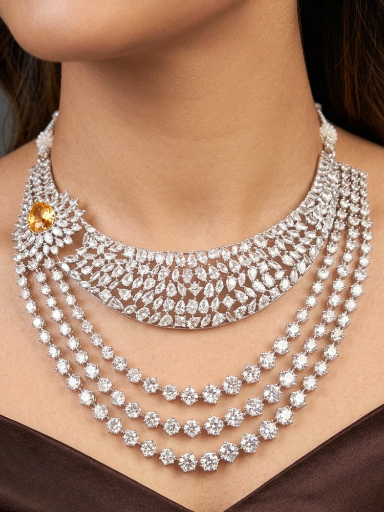 Close-up of a women wearing an ornate Western (Silver Polish) Layered jewellery set and earrings with American Diamond and Champaign Colored Stones. Elegant wedding jewelry look featuring a premium artificial American diamond necklace. A graceful woman wearing a trending American diamond necklace for a 2026 wedding celebration.