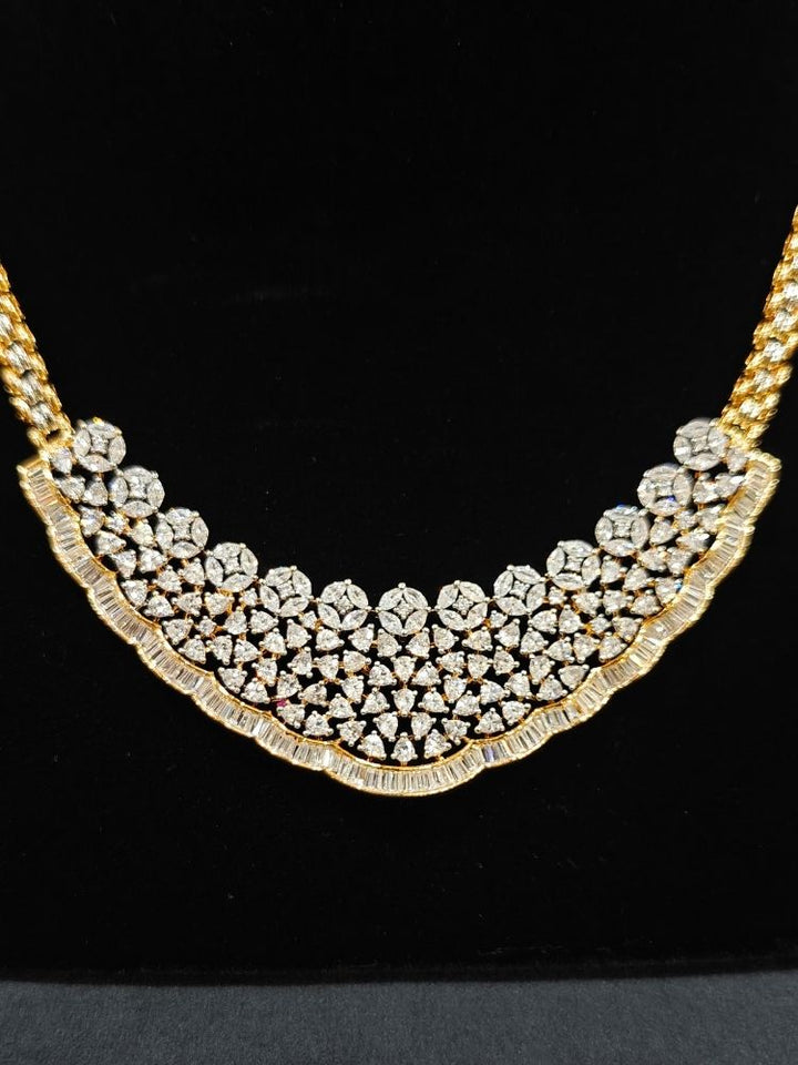 Close-up of  an ornate Western (Silver Polish) Collar jewellery set and earrings with American Diamond. Party wear outfit completed with a lightweight American diamond necklace. Reception-ready look featuring a American diamond jewelry set.