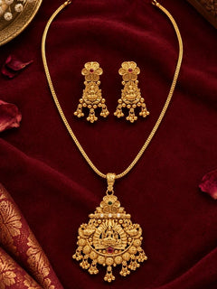 Shree Pendant Set – gold-plated temple pendant on a long chain with matching drop earrings, on maroon fabric