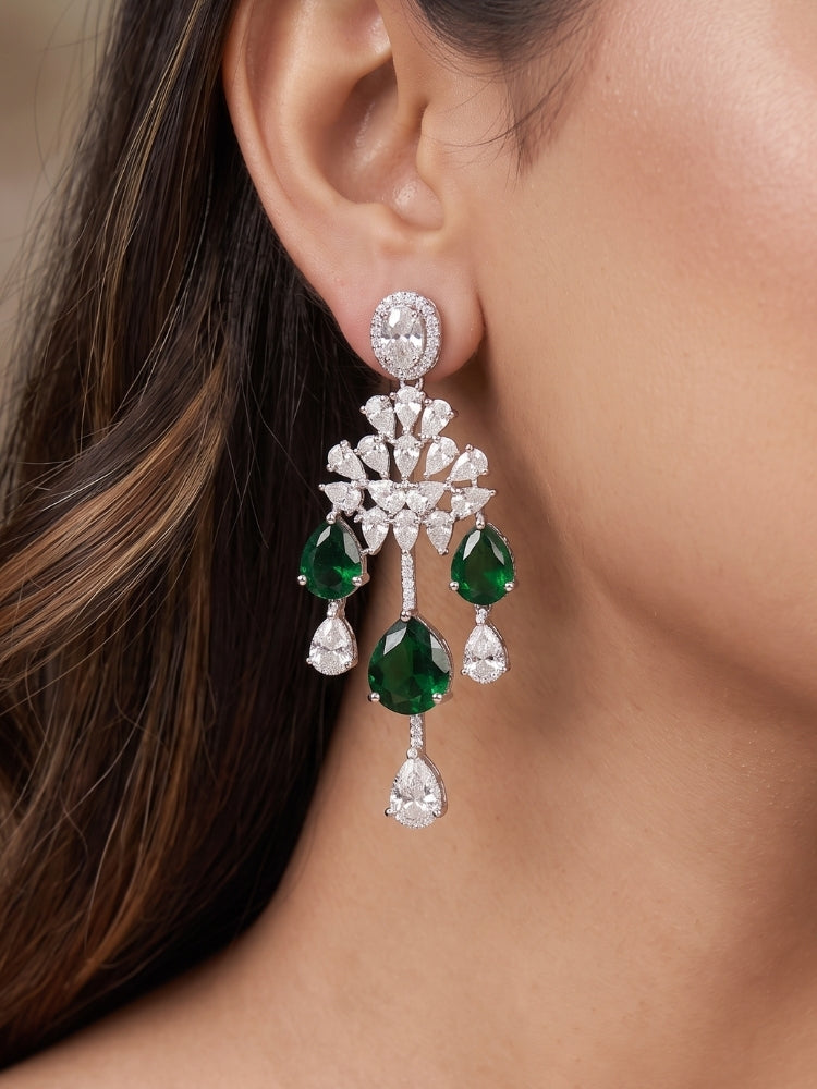 Close-up of a woman wearing an ornate Western (Silver Polish) Diamond Green Collar jewellery set and earrings with American Diamond and Green Colored Stone. Party wear outfit completed with a lightweight American diamond necklace.
Elegant wedding jewelry look featuring a premium artificial American diamond necklace.