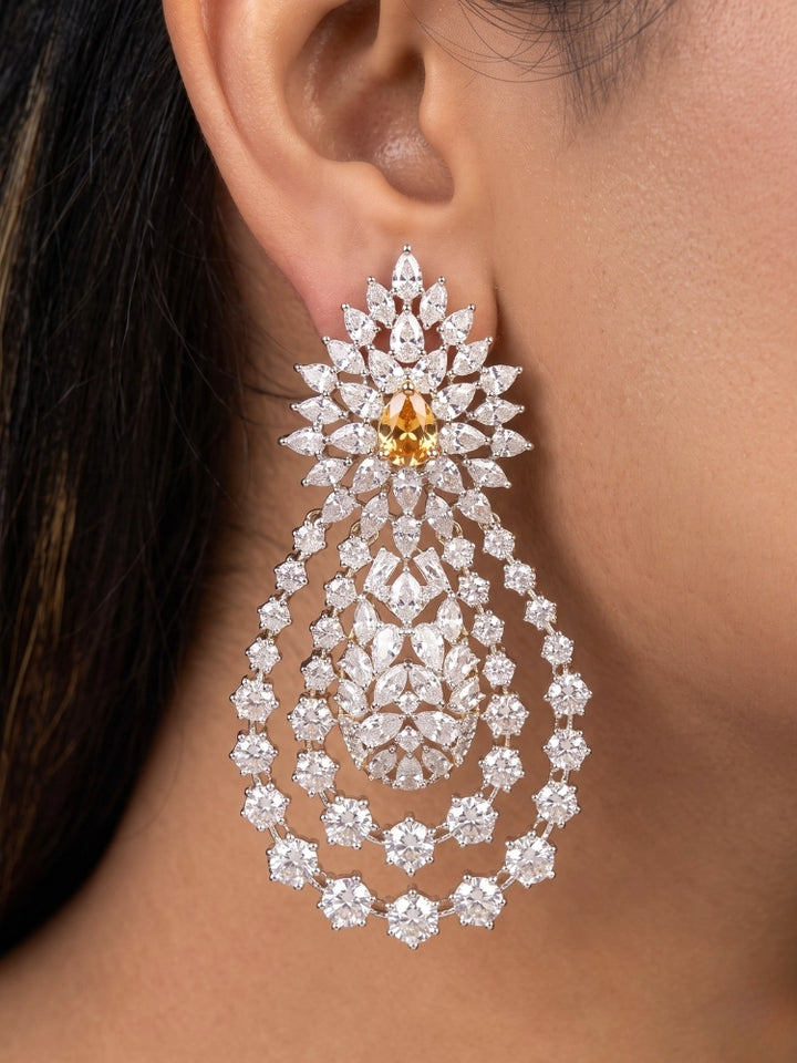 Close-up of a woman wearing an ornate Western (Silver Polish) Layered jewellery set and earrings with American Diamond and Champaign Colored Stones. Elegant wedding jewelry look featuring a premium artificial American diamond necklace. A graceful woman wearing a trending American diamond necklace for a 2026 wedding celebration.