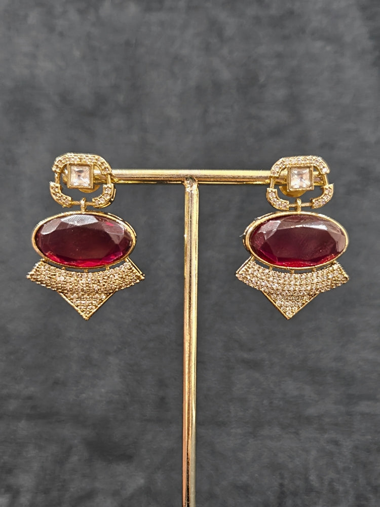 An exquisite artificial diamond and polki with red colored stone necklace and matching earrings, designed for the perfect engagement look. This stunning artificial diamond jewelry set offers luxury and sophistication while being an affordable alternative to natural diamonds.