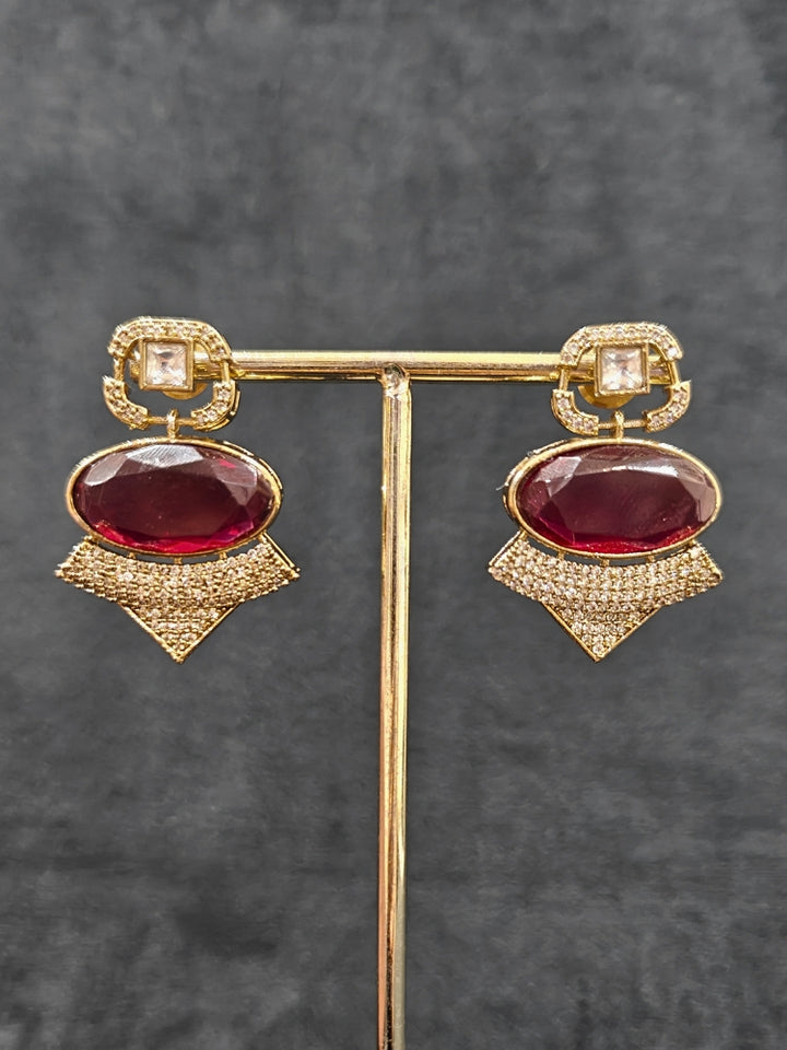 An exquisite artificial diamond and polki with red colored stone necklace and matching earrings, designed for the perfect engagement look. This stunning artificial diamond jewelry set offers luxury and sophistication while being an affordable alternative to natural diamonds.