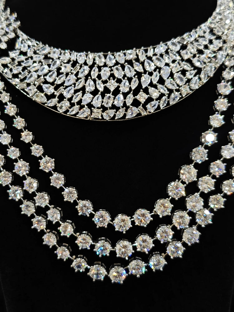 Close-up of an ornate Western (Silver Polish) Layered jewellery set and earrings with American Diamond and Champaign Colored Stones. Elegant wedding jewelry look featuring a premium artificial American diamond necklace. A graceful woman wearing a trending American diamond necklace for a 2026 wedding celebration.