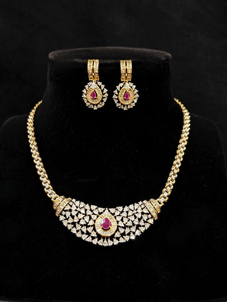 Close-up o an ornate Western (Silver Polish) Pink Collar jewellery set and earrings with Pink Colored Stone and American Diamond.Woman styling a statement American diamond necklace with an off-shoulder gown for a reception. Party wear outfit completed with a lightweight American diamond necklace.