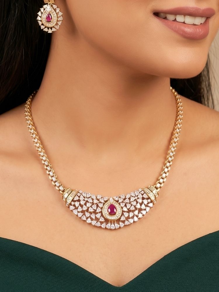Close-up of a woman wearing an ornate Western (Silver Polish) Pink Collar jewellery set and earrings with Pink Colored Stone and American Diamond.Woman styling a statement American diamond necklace with an off-shoulder gown for a reception. Party wear outfit completed with a lightweight American diamond necklace.