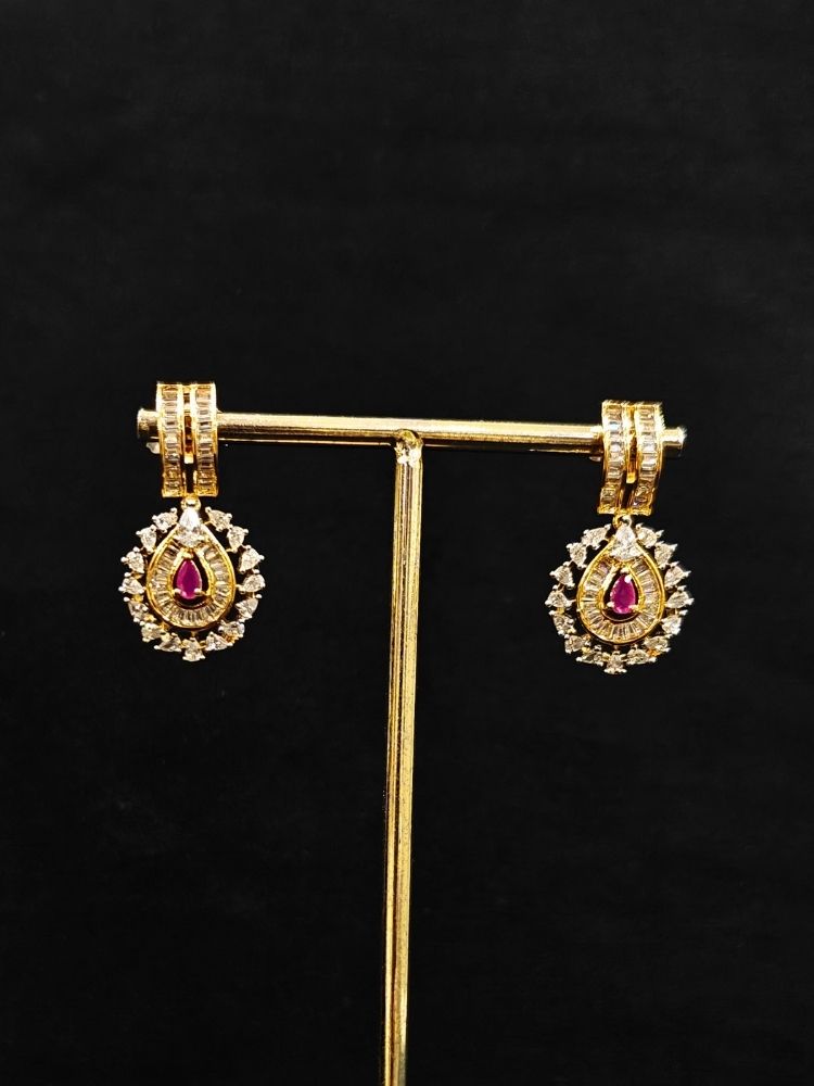 Close-up o an ornate Western (Silver Polish) Pink Collar jewellery set and earrings with Pink Colored Stone and American Diamond.Woman styling a statement American diamond necklace with an off-shoulder gown for a reception. Party wear outfit completed with a lightweight American diamond necklace.
