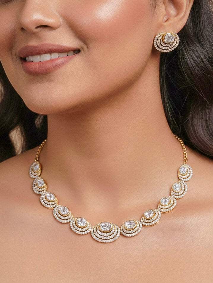 Close-up of a woman wearing an ornate Indo-western American Diamond gold Collar jewellery set and earrings with American Diamond and Monalisa Stones. Close-up of a cocktail party look featuring a premium American diamond necklace.
Festive celebration look featuring an American Diamond artificial necklace.
