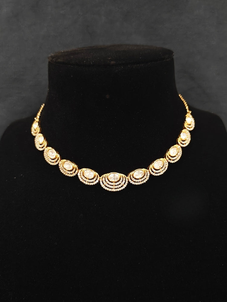 Close-up of an ornate Indo-western American Diamond gold Collar jewellery set and earrings with American Diamond and Monalisa Stones. Close-up of a cocktail party look featuring a premium American diamond necklace.
Festive celebration look featuring an American Diamond artificial necklace.