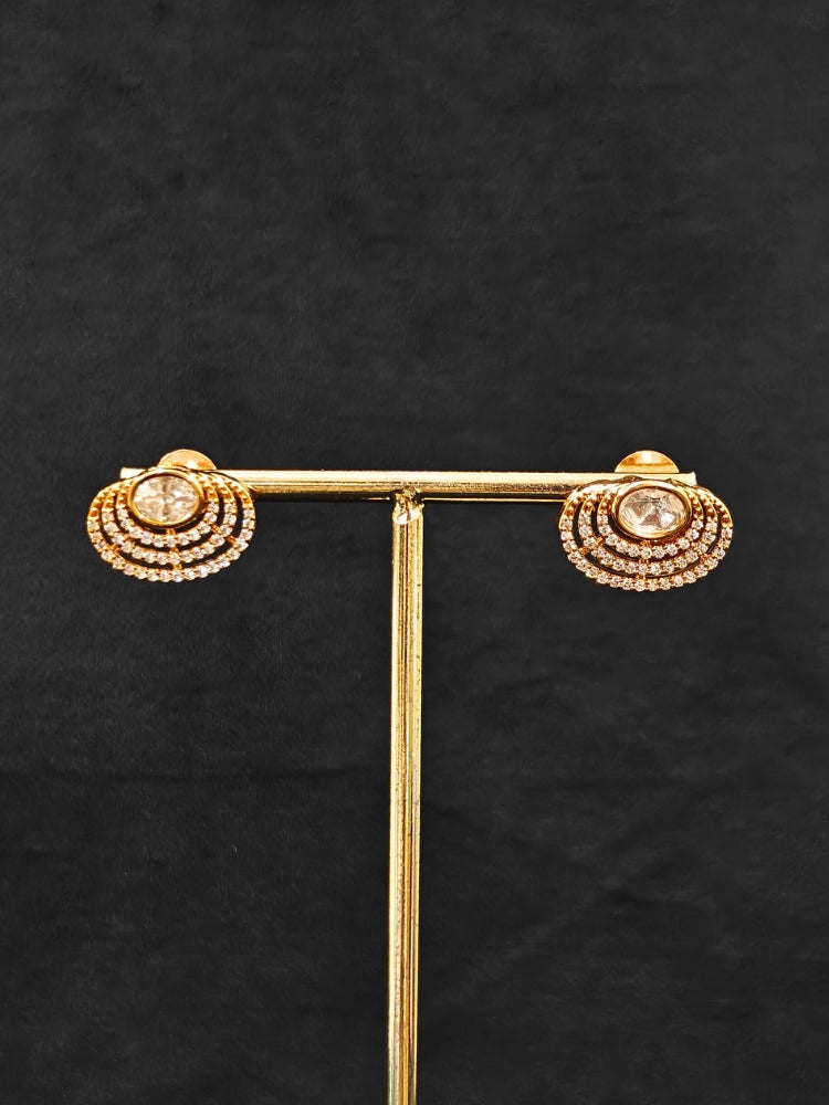 Close-up of an ornate Indo-western American Diamond gold Collar jewellery set and earrings with American Diamond and Monalisa Stones. Close-up of a cocktail party look featuring a premium American diamond necklace.
Festive celebration look featuring an American Diamond artificial necklace.