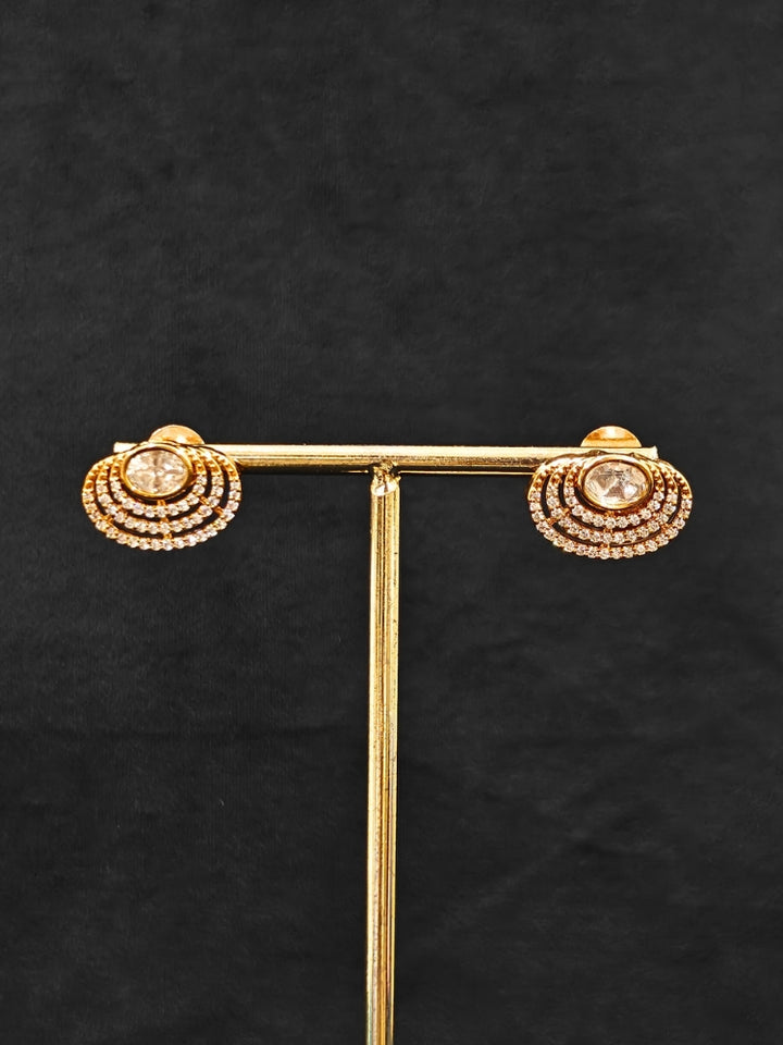 Close-up of an ornate Indo-western American Diamond gold Collar jewellery set and earrings with American Diamond and Monalisa Stones. Close-up of a cocktail party look featuring a premium American diamond necklace.
Festive celebration look featuring an American Diamond artificial necklace.
