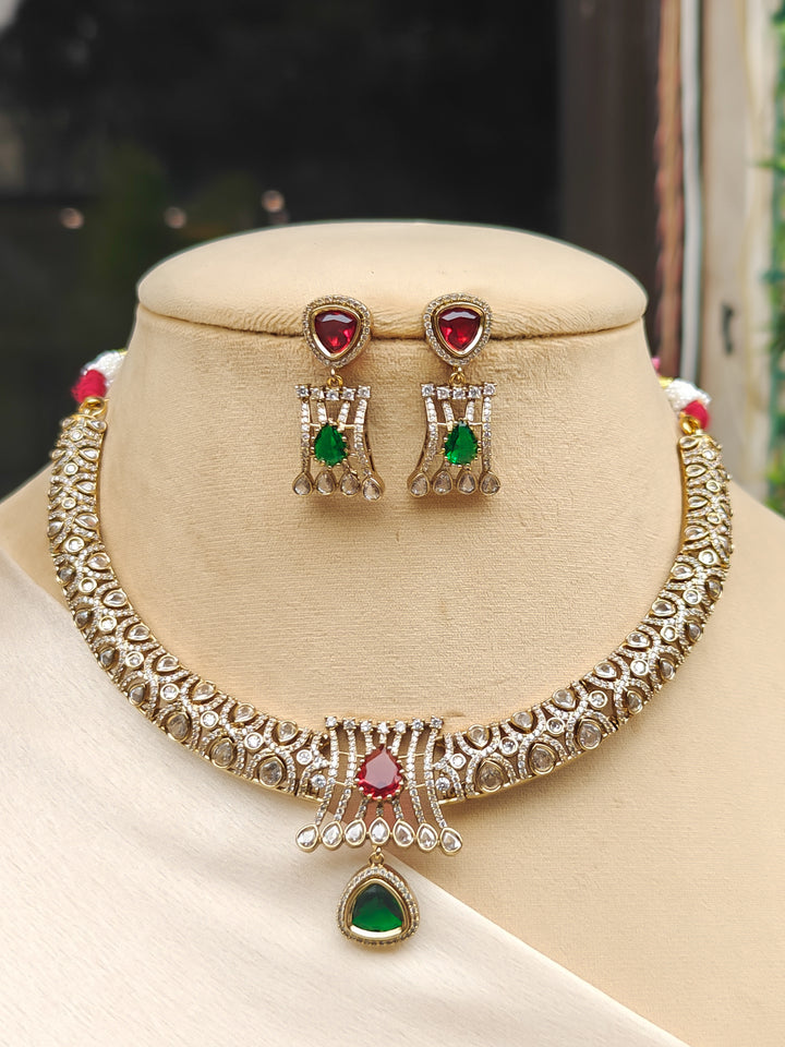 "Close-up of a model in luxurious artificial diamond jewelry featuring a designer diamond and polki with green and red colored stone necklace and earrings set, crafted for bridal fashion and high-end weddings. This beautiful diamond jewelry set offers the brilliance of real diamonds at an affordable price."
