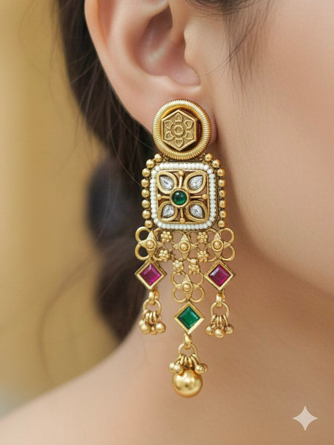 Close-up of a woman wearing an ornate traditional Rajwadi gold Choker jewellery set and earrings with Brass, Stones, Pearls and Bandhai Work. Festive look completed with a luxury Rajwadi imitation necklace. Model wearing a royal Rajwadi necklace set for festive celebrations in India.