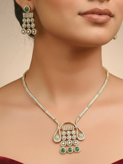 "A beautiful woman wearing an elegant artificial diamond necklace with green colored stone and matching earrings. This premium artificial diamond jewelry set is perfect for special occasions, from Indian weddings to engagement parties, offering sophisticated glamour without the high price tag."
