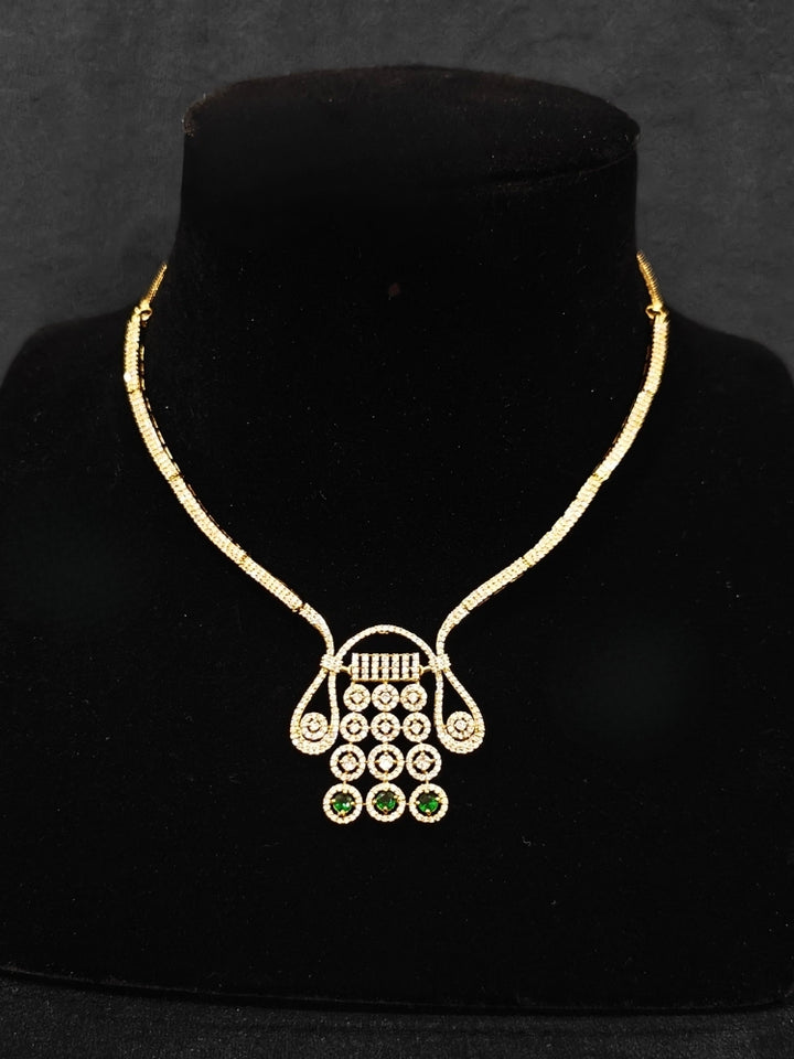 An elegant artificial diamond necklace with green colored stone and matching earrings. This premium artificial diamond jewelry set is perfect for special occasions, from Indian weddings to engagement parties, offering sophisticated glamour without the high price tag.