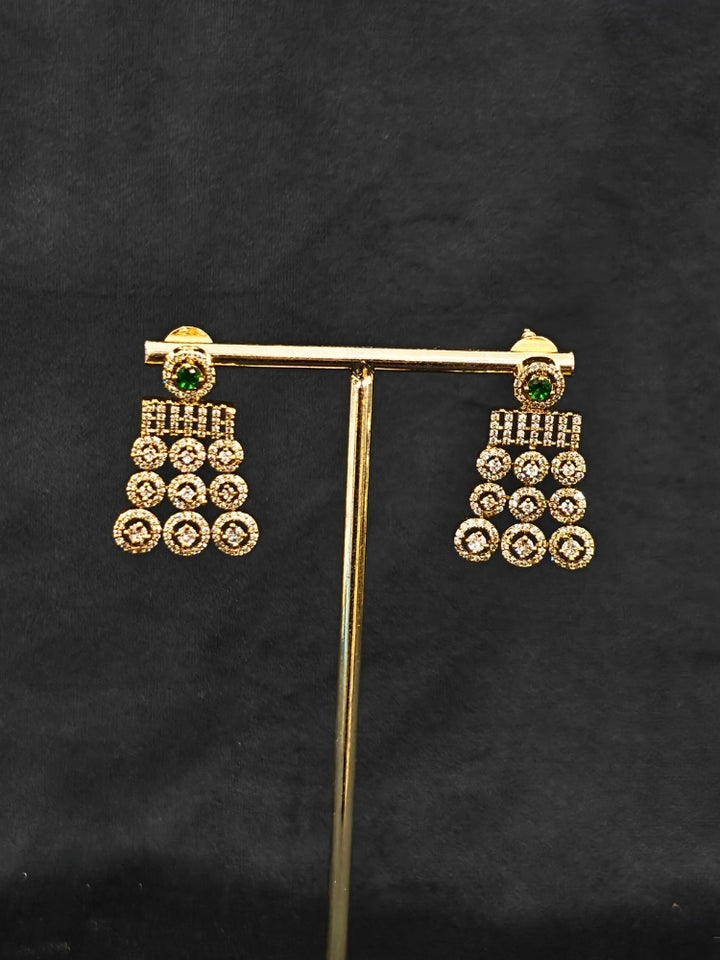 An elegant artificial diamond necklace with green colored stone and matching earrings. This premium artificial diamond jewelry set is perfect for special occasions, from Indian weddings to engagement parties, offering sophisticated glamour without the high price tag.