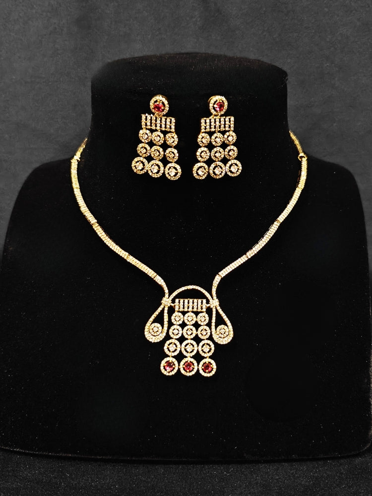 A luxurious artificial diamond necklace with red colored stone and matching earrings, perfect for high-profile wedding receptions and formal galas. This high-end artificial diamond jewelry set combines style, elegance, and affordability for special occasions.