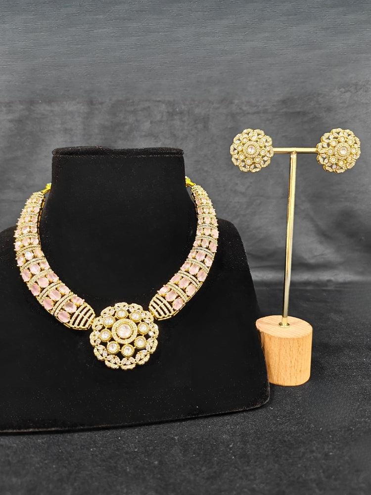 Close-up of a woman wearing an ornate traditional Mint Pink Collar Gold jewellery set and earrings with American Diamond and Colored Stones. Mehendi function outfit styled with a lightweight American Diamond necklace. Festive celebration look featuring a American Diamond artificial necklace.