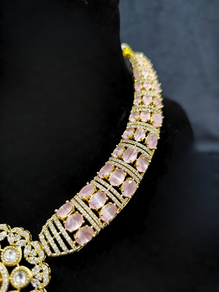 Close-up of a woman wearing an ornate traditional Mint Pink Collar Gold jewellery set and earrings with American Diamond and Colored Stones. Mehendi function outfit styled with a lightweight American Diamond necklace. Festive celebration look featuring a American Diamond artificial necklace.