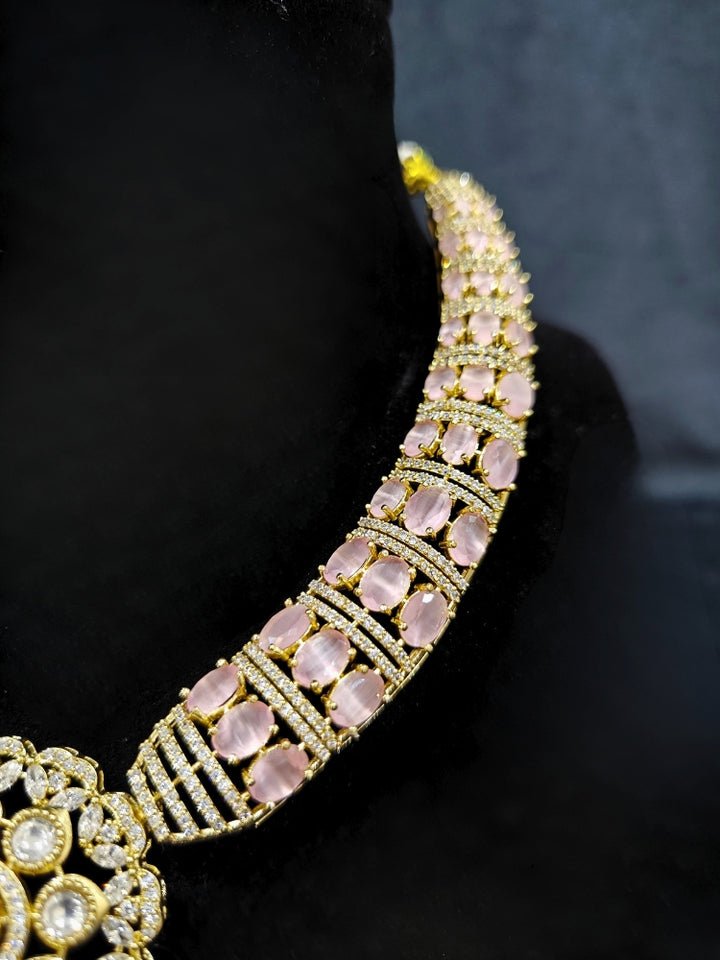 Close-up of a woman wearing an ornate traditional Mint Pink Collar Gold jewellery set and earrings with American Diamond and Colored Stones. Mehendi function outfit styled with a lightweight American Diamond necklace. Festive celebration look featuring a American Diamond artificial necklace.