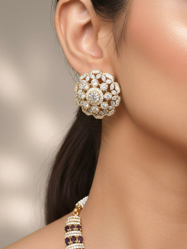 "A stunning woman wearing a glamorous artificial diamond and purple colored stone necklace paired with chic earrings, perfect for bridal wear. This high-quality artificial diamond jewelry set is the ideal choice for modern brides looking for a budget-friendly option with timeless sparkle."
