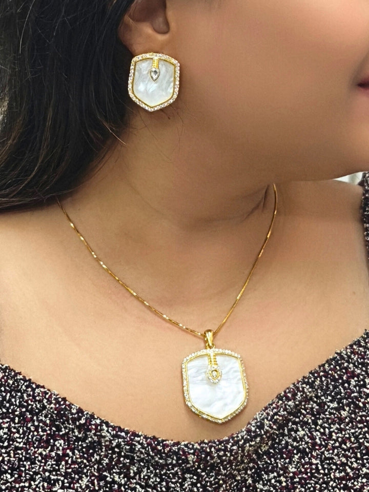 Close-up of a woman wearing an ornate Indo-Western (Gold Polish) White Diamond Pendant Set with American Diamond, Monalisa Stone and Kundan. Festive Diwali outfit styled with an American diamond artificial Pendant. Reception-ready look featuring a statement American diamond Pendant set.