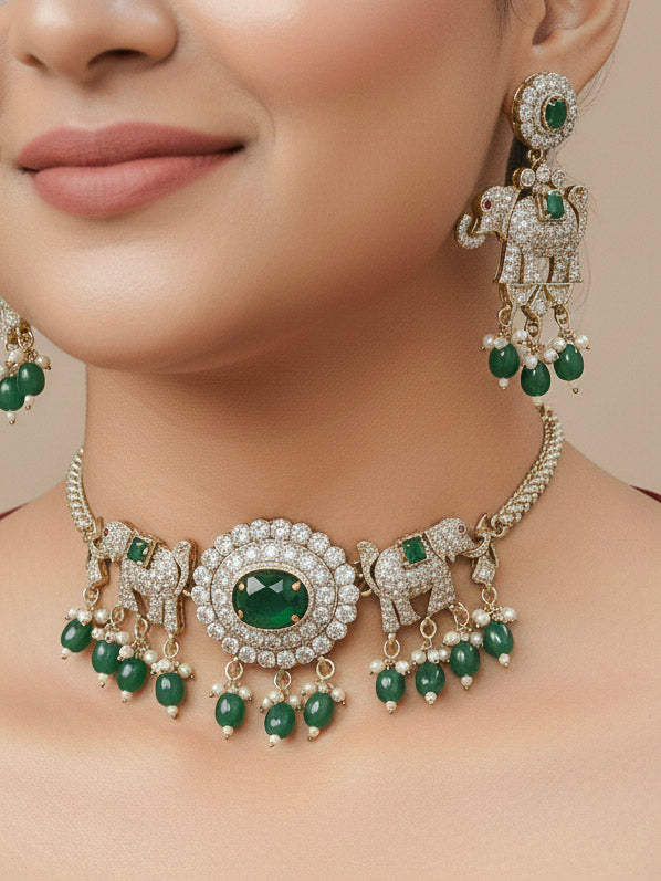 Close-up of a woman wearing an ornate traditional Dark Green (Mehendi gold Polish) Choker Diamond jewellery set and earrings with American Diamond, Colored Stone and Pearls. Elegant festive look with a high-quality imitation American diamond necklace set. A woman wearing a luxury American diamond necklace set styled beautifully for a wedding guest look in India.