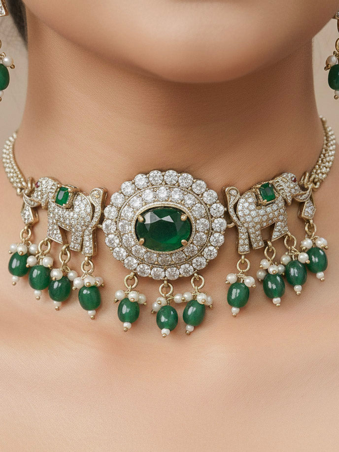 Close-up of a woman wearing an ornate traditional Dark Green (Mehendi gold Polish) Choker Diamond jewellery set and earrings with American Diamond, Colored Stone and Pearls. Elegant festive look with a high-quality imitation American diamond necklace set. A woman wearing a luxury American diamond necklace set styled beautifully for a wedding guest look in India.