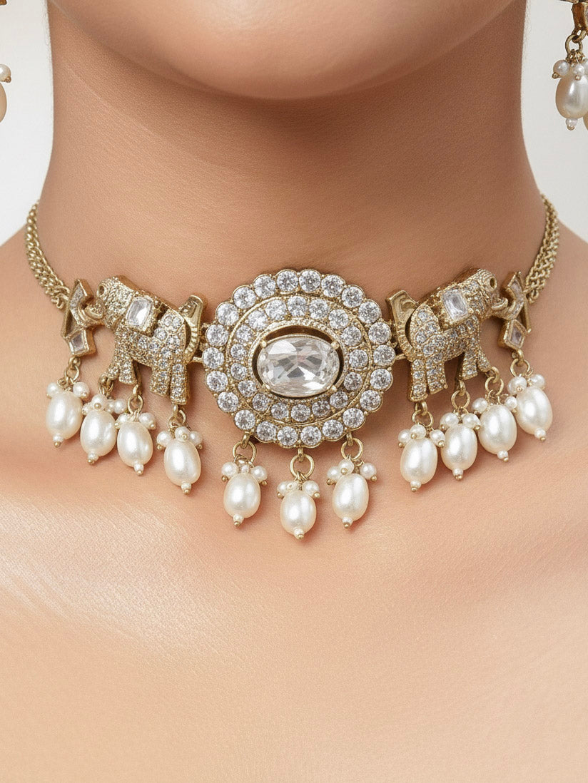 Close-up of a woman wearing an ornate traditional White (Mehendi gold Polish) Choker Diamond jewellery set and earrings with American Diamond and Pearls. Elegant festive look with a high-quality imitation American diamond necklace set. A woman wearing a luxury American diamond necklace set styled beautifully for a wedding guest look in India.