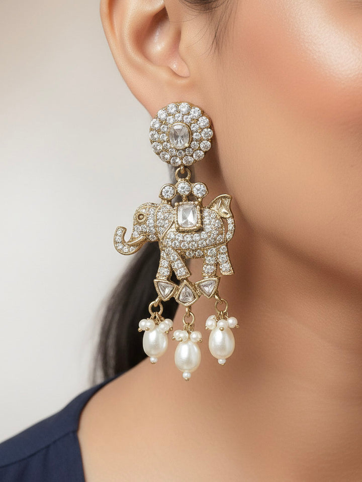 Close-up of a woman wearing an ornate traditional White (Mehendi gold Polish) Choker Diamond jewellery set and earrings with American Diamond and Pearls. Elegant festive look with a high-quality imitation American diamond necklace set. A woman wearing a luxury American diamond necklace set styled beautifully for a wedding guest look in India.