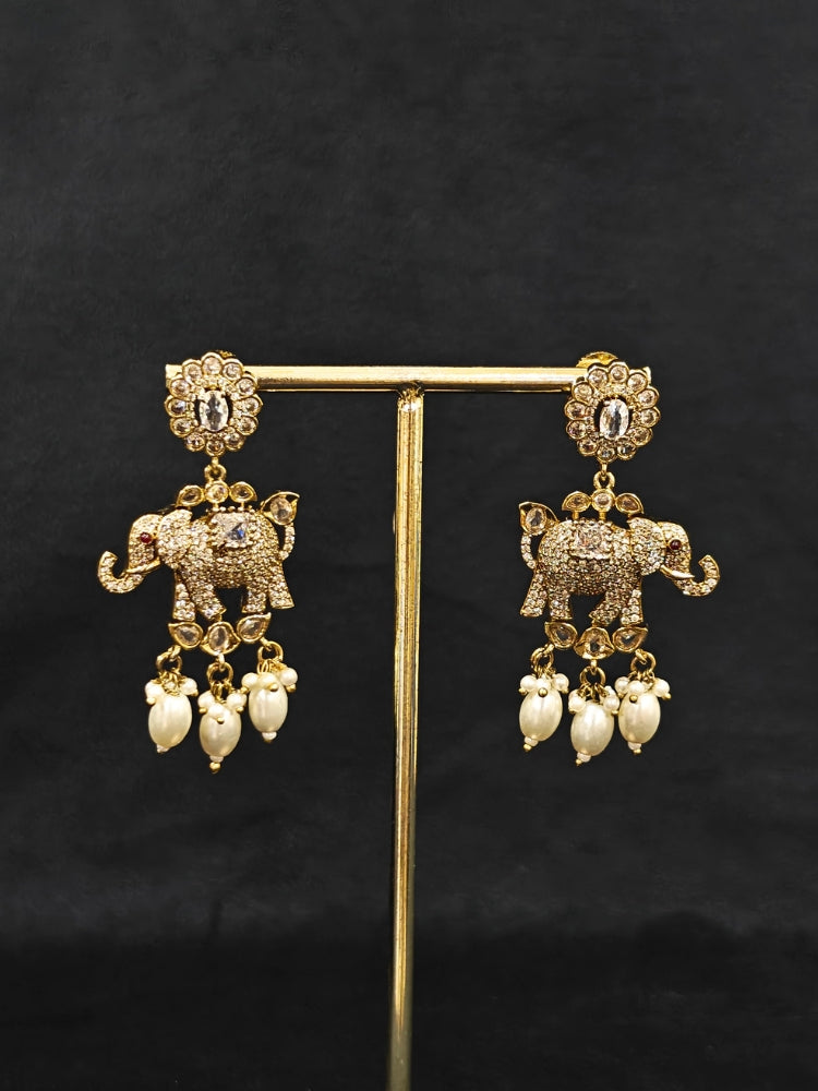 Close-up of an ornate traditional White (Mehendi gold Polish) Choker Diamond jewellery set and earrings with American Diamond and Pearls. Elegant festive look with a high-quality imitation American diamond necklace set. A luxury American diamond necklace set styled beautifully for a wedding guest look in India.